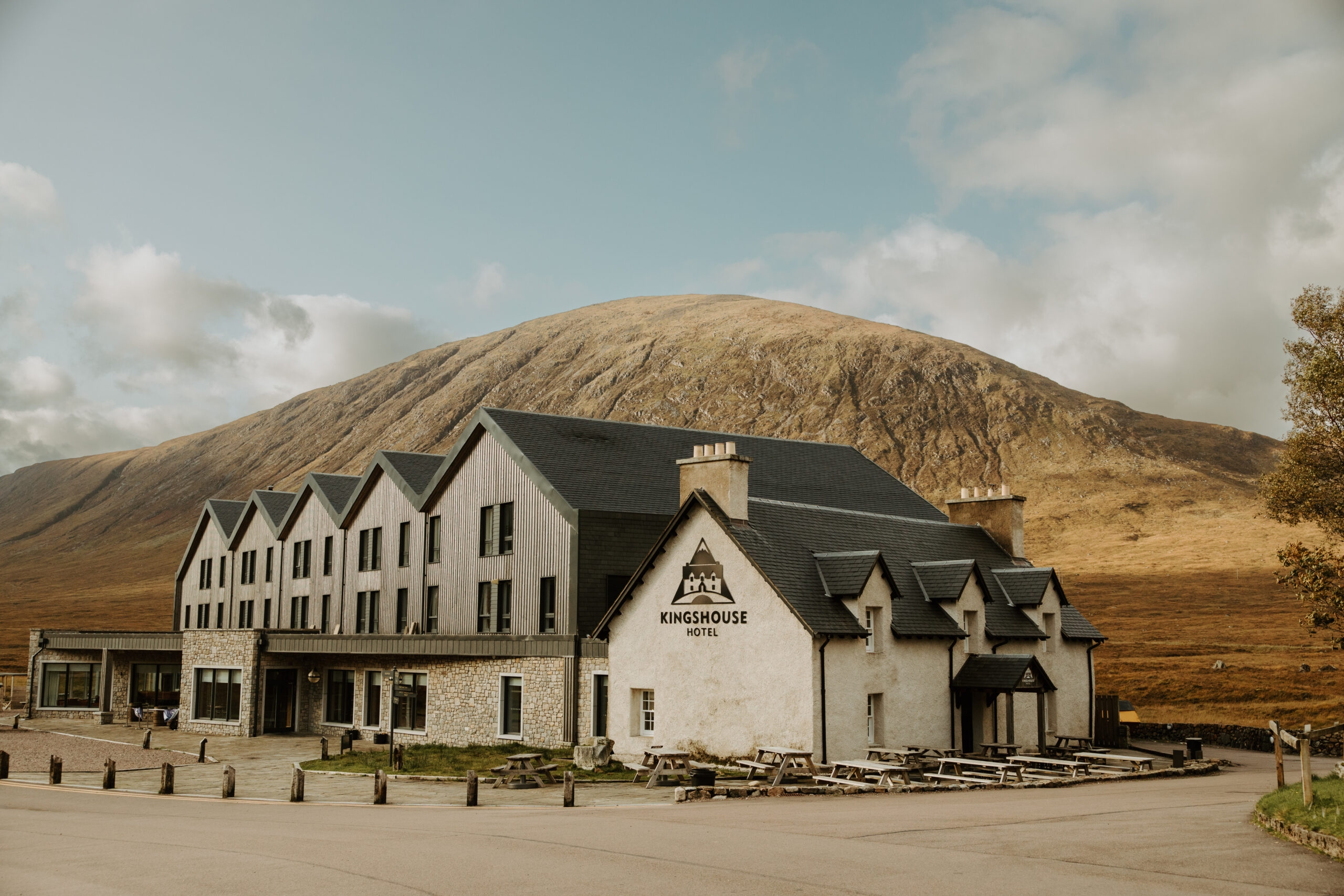 The Kings Hotel in Scotland, showcasing its charming architecture surrounded by lush greenery and classic Scottish countryside vibes, a perfect setting for a memorable elopement stay