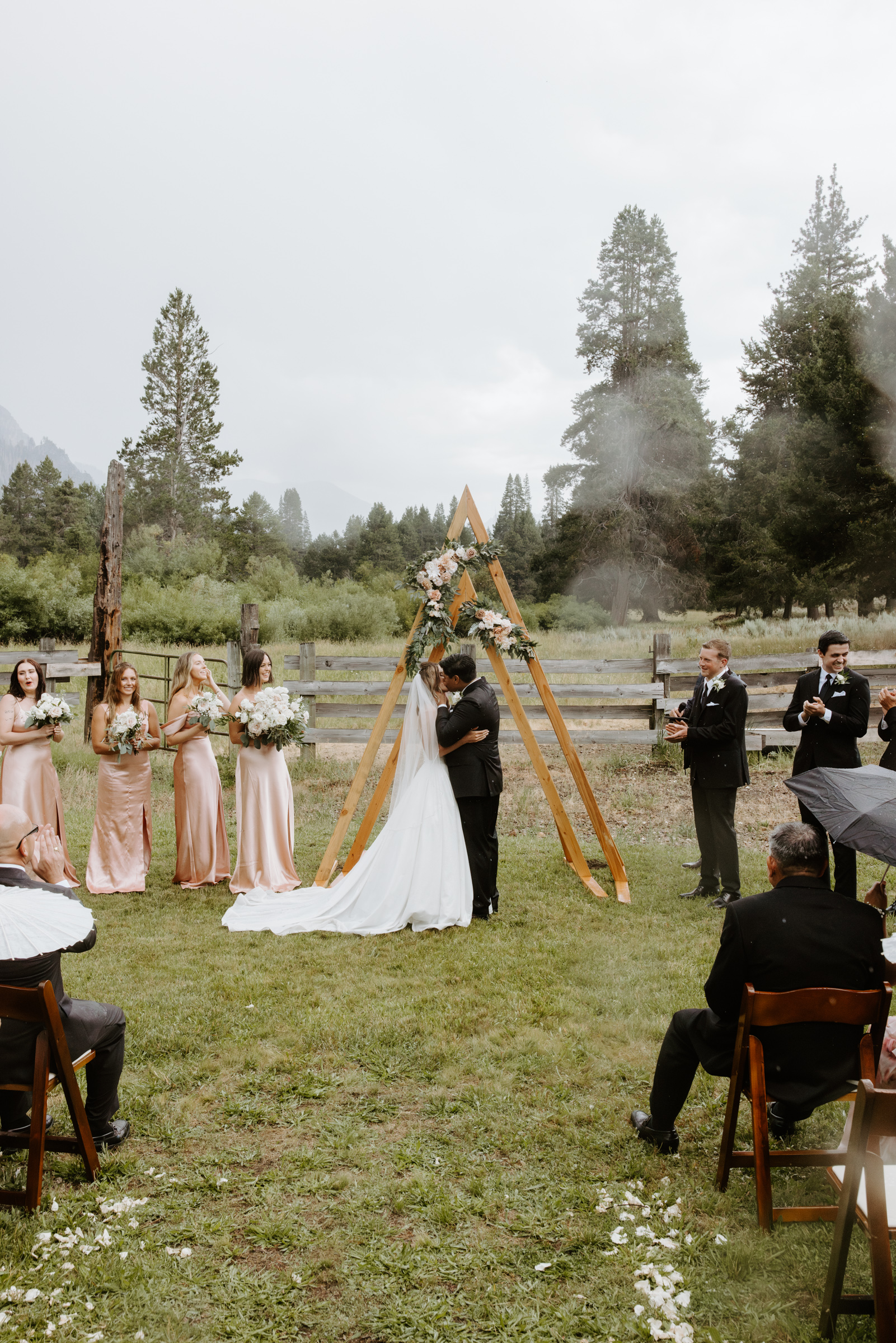 Couple kissing at the altar during their wedding ceremony with breathtaking views