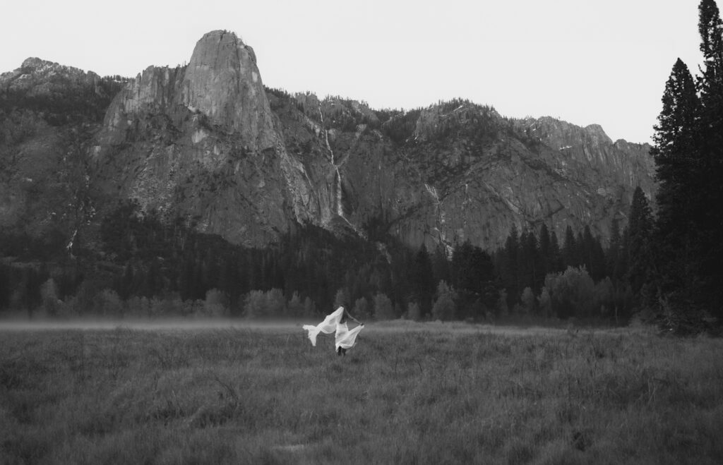 Candid moment of bride laughing during elopement in Yosemite's alpine forest